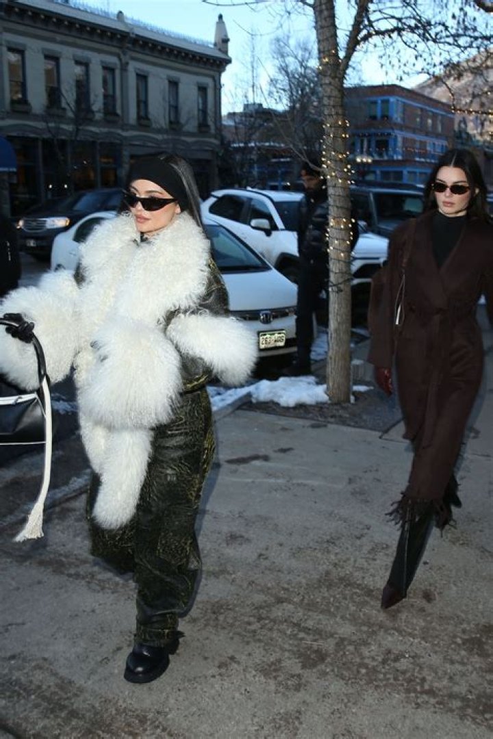 Aspen, CO - *EXCLUSIVE* -Kylie and Kendall Jenner enjoy a night out at 'Matsuhisa' Sushi Restaurant in Aspen Colorado.The sisters put on a very stylish display as they stepped out together for dinner on Sunday for a girl&rsquo;s night out. Kylie stepped out in jeans, a white collared top with buttons and a fur bucket hat. Kendall put on a chic display in all black and a leather coat with fur lining. Pictured: Kylie Jenner BACKGRID USA 12 DECEMBER 2022 BYLINE MUST READ: 1 / BACKGRID USA: +1 310 798 9111 / UK: +44 208 344 2007 / *UK Clients - Pictures Containing Children Please Pixelate Face Prior To Publication*