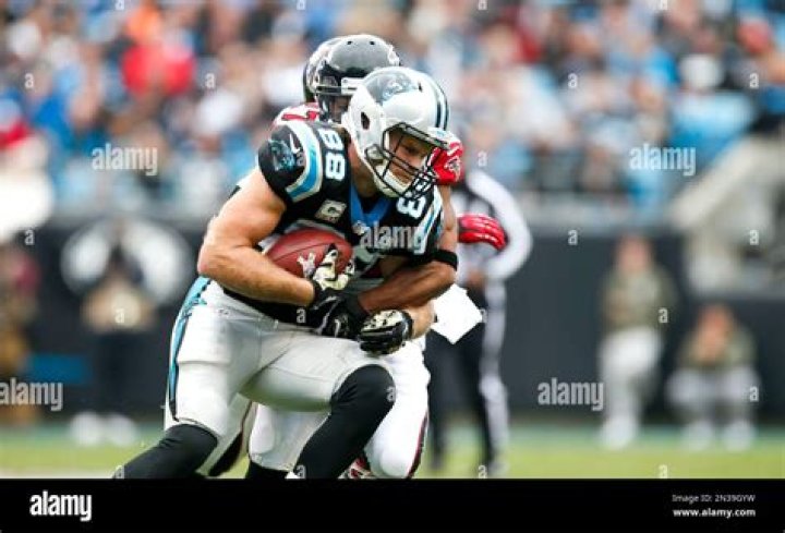 Carolina Panthers tight end Greg Olsen talks to teammates during the first half of an NFL football game against the Buffalo Bills, in Orchard Park, N.Y Panthers Bills Football, Orchard Park, USA - 09 Aug 2018