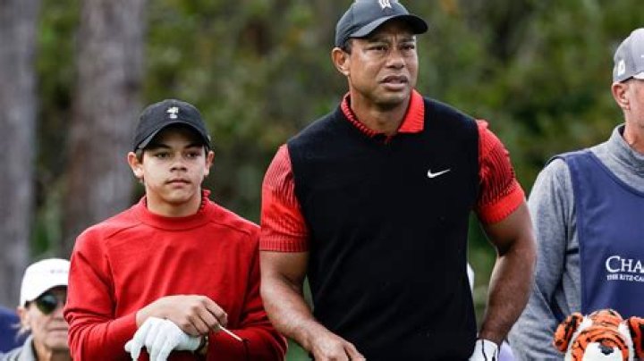 Tiger Woods and his son Charlie Woods wait to tee off on the first hole during the first round of the 2022 PNC Championship at The Ritz-Carlton Golf Club in Orlando. PNC Championship Golf Tournament in Orlando, US - 17 Dec 2022